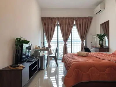 a bedroom with a bed and a television in a room at Ampang 2 -3 pax Studio Ampang Point in Ampang
