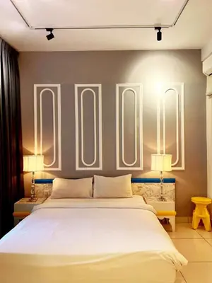 a bedroom with a large white bed and two lamps at Arte Mont Kiara 1-4 pax -MITEC-Kuala Lumpur by Infistay Homestay in Kuala Lumpur