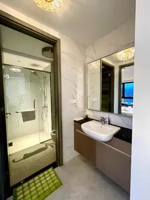 a bathroom with a sink and a shower at Agile Sky Pavilion Residence KL TRX by Moonlight in Kuala Lumpur