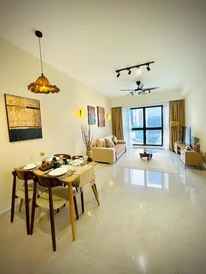 a living room with a table and a couch at Agile Sky Pavilion Residence KL TRX by Moonlight in Kuala Lumpur