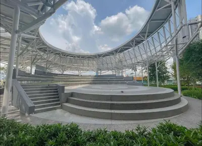 a large building with stairs in a park at trion kl TRX klcc view in Kuala Lumpur