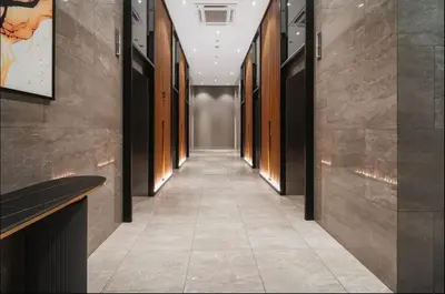 a hallway of a building with a long corridor at trion kl TRX klcc view in Kuala Lumpur