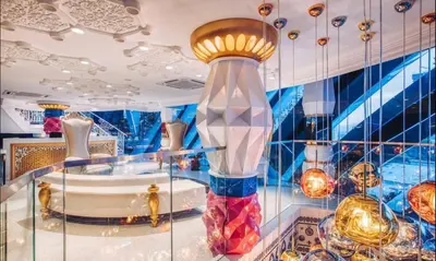 a glass display case with a bunch of vases at Duplex Arte Mont Kiara modern design nice view in Kuala Lumpur