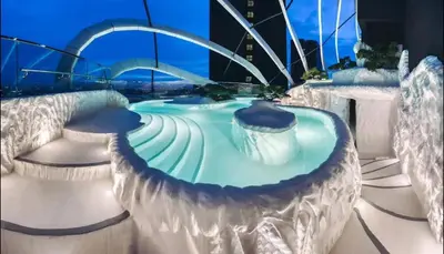 a water park in a city at night at Duplex Arte Mont Kiara modern design nice view in Kuala Lumpur