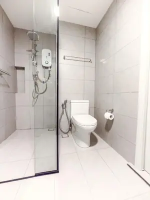 a bathroom with a shower and a toilet at The Atrium at Jalan Ampang by OKBnB - Modern Stylish 2Bedroom with FREE WiFi and Carpark in Kuala Lumpur