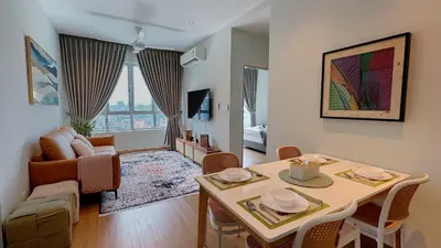 a living room with a table and a couch at MH Platinum 2 COZY Fully Air-Con Suite Kuala Lumpur in Kuala Lumpur
