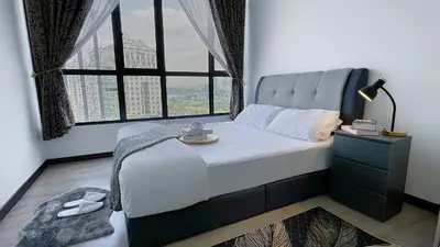 a bedroom with a bed with a large window at MH Platinum 2 COZY Fully Air-Con Suite Kuala Lumpur in Kuala Lumpur