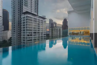 a swimming pool with a city skyline in the background at 1Bukit ceylon view 118 in Kuala Lumpur