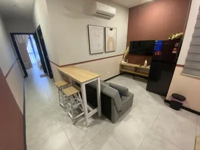 a living room with a table and a couch at KL City, Neu Suites 2Bedroom 1Bathroom in Kuala Lumpur
