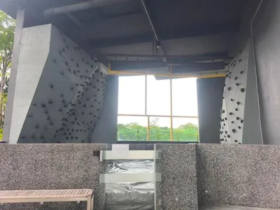 a climbing wall in a building with a climbing gym at 8Pax Green View next to KL118 ChinaTown n Train Station in Kuala Lumpur