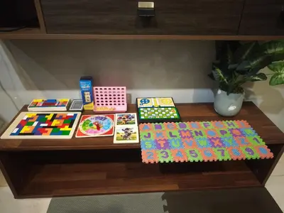 a table topped with lots of colorful items on it at 6pax 2BR KL118 View 5min to train Station in Kuala Lumpur