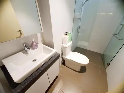 a bathroom with a sink and a toilet and a shower at The Establisment KL Sentral by GBS in Kuala Lumpur