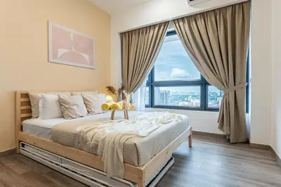 a bedroom with a large bed with a large window at TRX View Muji Room 5 min to Bukit Bintang at Agile in Kuala Lumpur