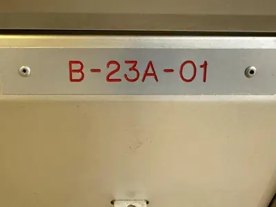 a sign on the side of a machine with the number b oh at Cosy Studio Apartment at Hartamas in Kuala Lumpur