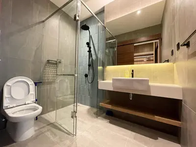 a bathroom with a toilet and a sink and a shower at Alfa Bangsar by The Homez in Kuala Lumpur