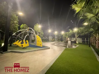 a park at night with a swings at Alfa Bangsar by The Homez in Kuala Lumpur