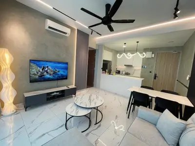 a living room with a couch and a table at Alfa Bangsar by The Homez in Kuala Lumpur