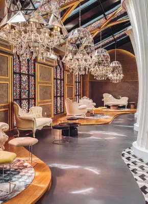 a room with chandeliers and chairs and tables at Duplex Arte Mont kiara 2 bedroom in Kuala Lumpur