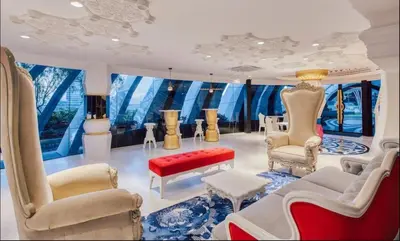 a living room with chairs and a couch and tables at Arte mont kiara duplex 2 bedroom in Kuala Lumpur