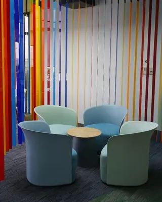 a room with chairs and a table and colored walls at Riveria City, Kl Sentral Studio Apartment near Monorail, Infinity Pool in Kuala Lumpur