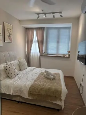 a bedroom with a white bed with a large window at Riveria City, Kl Sentral Studio Apartment near Monorail, Infinity Pool in Kuala Lumpur