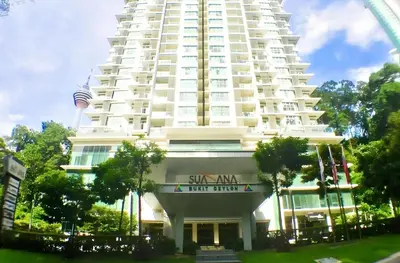 a large white building with a sign on it at Suasana Bukit Ceylon by Goldcrests Global in Kuala Lumpur