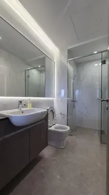a bathroom with a sink and a toilet and a mirror at Design House Kuala Lumpur #P3 in Kuala Lumpur