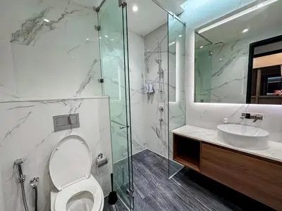 a bathroom with a shower and a toilet and a sink at Core Residence at TRX by LL in Kuala Lumpur