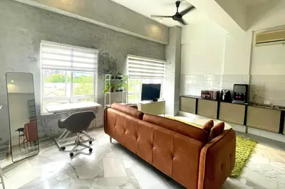 a living room with a couch and a chair at 2 Bedroom Apartment l City View in Kuala Lumpur