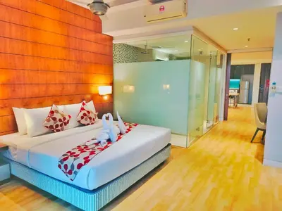 a bedroom with a bed with two teddy bears on it at Oneiro D'Majestic place Klcc in Kuala Lumpur