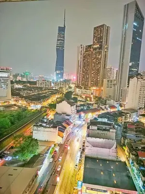 a city at night with traffic on a busy street at Oneiro D'Majestic place Klcc in Kuala Lumpur