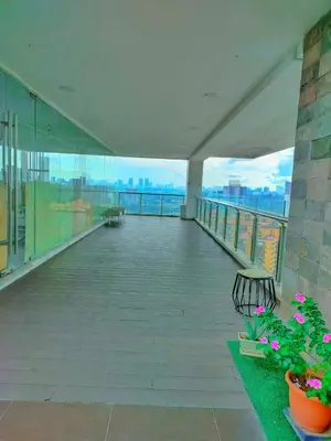 a balcony of a building with a view of the ocean at Oneiro D'Majestic place Klcc in Kuala Lumpur