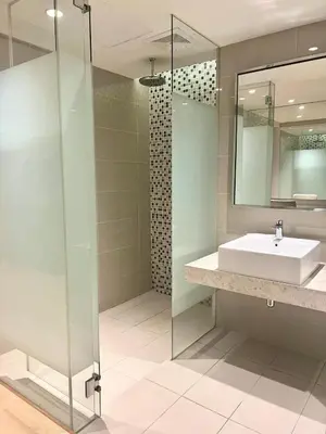 a bathroom with a sink and a glass shower at Oneiro D'Majestic place Klcc in Kuala Lumpur