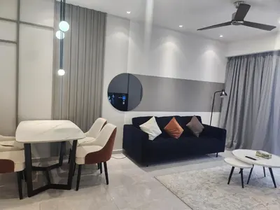 a living room with a couch and a table at TRION KL Family Residence at Kuala Lumpur in Kuala Lumpur