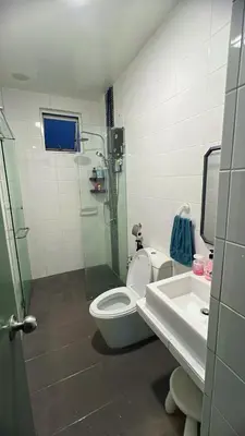 a bathroom with a shower and a toilet and a sink at AS Homes Kuala Lumpur in Kuala Lumpur