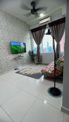 a living room with a flat screen tv on a wall at AS Homes Kuala Lumpur in Kuala Lumpur