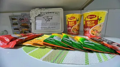 a table with some food on top of it at AS Homes Kuala Lumpur in Kuala Lumpur