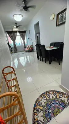 a living room with a table and chairs at AS Homes Kuala Lumpur in Kuala Lumpur
