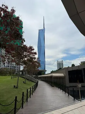 a tall building in the middle of a city at Casa Residency in BBCC in Kuala Lumpur