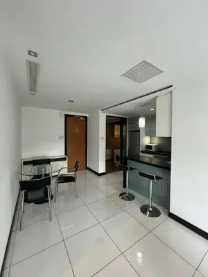 a kitchen and dining room with a table and chairs at Casa Residency in BBCC in Kuala Lumpur