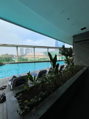 a car parked in a parking lot next to water at Casa Residency in Bukit in Kuala Lumpur