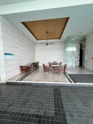 a dining area with tables and chairs in a building at Casa Residency in Bukit in Kuala Lumpur