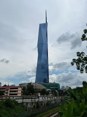 a tall blue building in the middle of a city at Near Jalan Alor in Kuala Lumpur