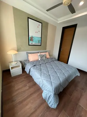 a bedroom with a bed and a ceiling fan at Comfy place near Bukit in Kuala Lumpur