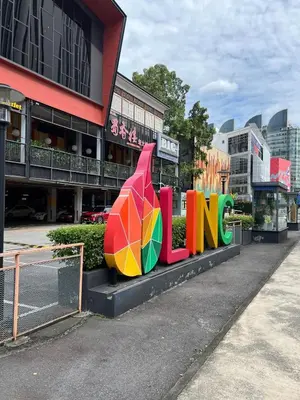 a sign that says fun in front of a building at Convenient KLCC 2-Bedroom Unit in Kuala Lumpur