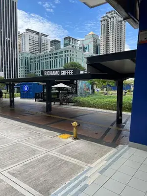 a train station with a fire hydrant in a city at Convenient KLCC 2-Bedroom Unit in Kuala Lumpur