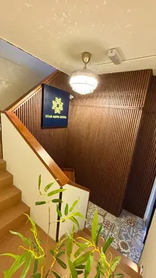 a room with stairs and a sign on the wall at Star Mews Hotel Changkat Bukit Bintang in Kuala Lumpur