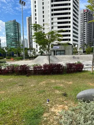 a park in a city with tall buildings at Convenient KLCC in Kuala Lumpur