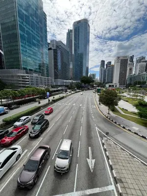 a city street with cars parked on the road at Convenient KLCCAmpang Park Unit in Kuala Lumpur