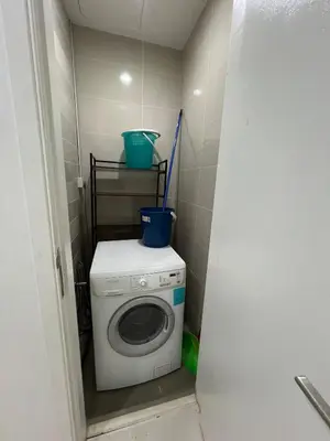 a washer and dryer in a small bathroom at Convenient KLCCAmpang Park Unit in Kuala Lumpur